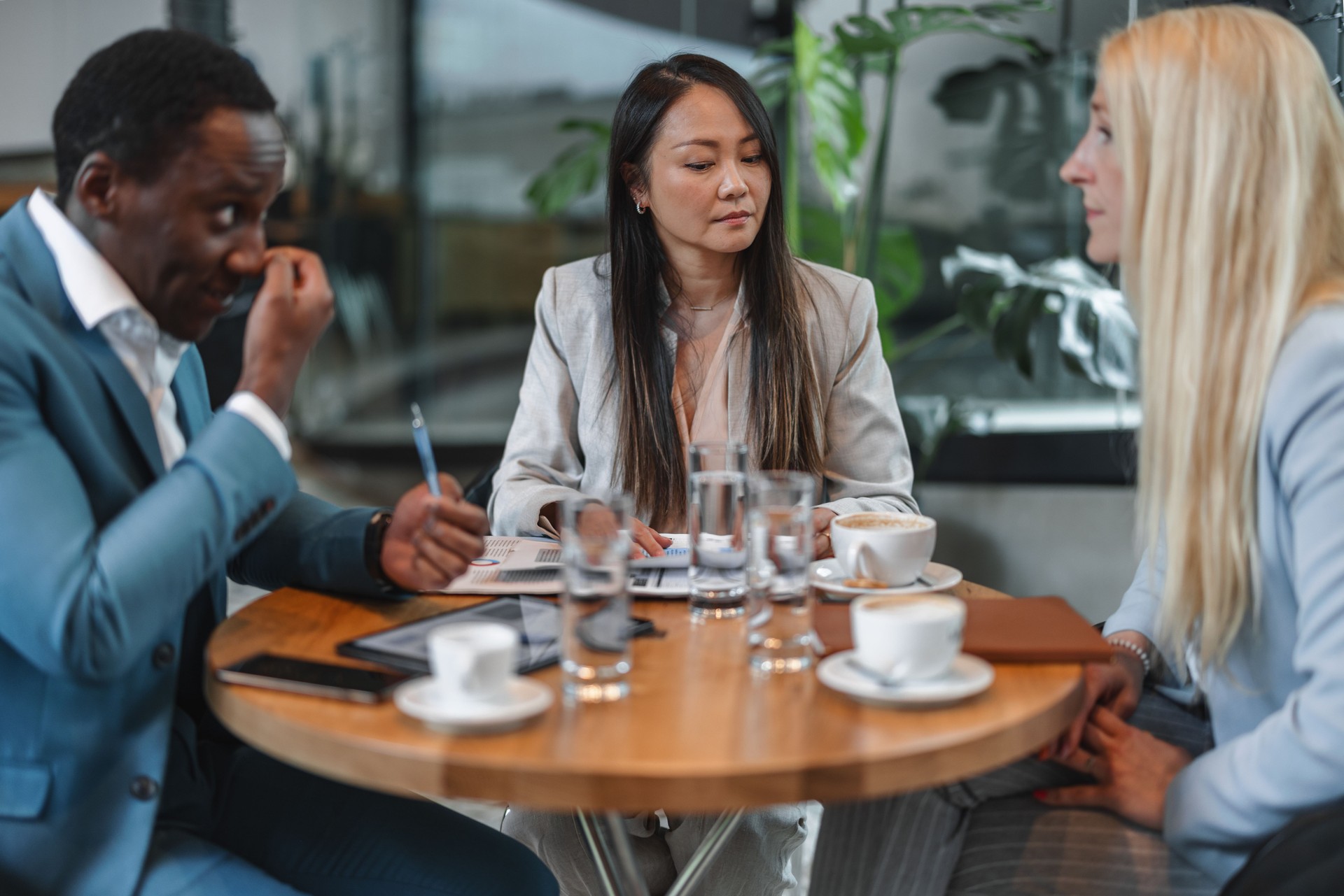 Diverse Businesspeople Grabbing A Cup Of Coffee At Cafeteria