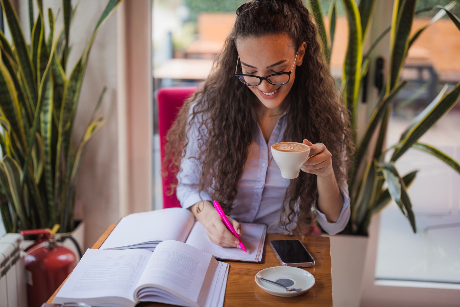 Young woman working during a coffee break